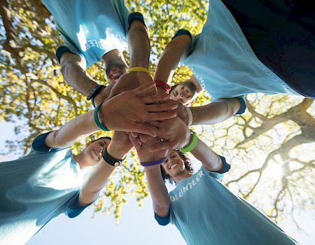 A group of people wearing blue shirts with 